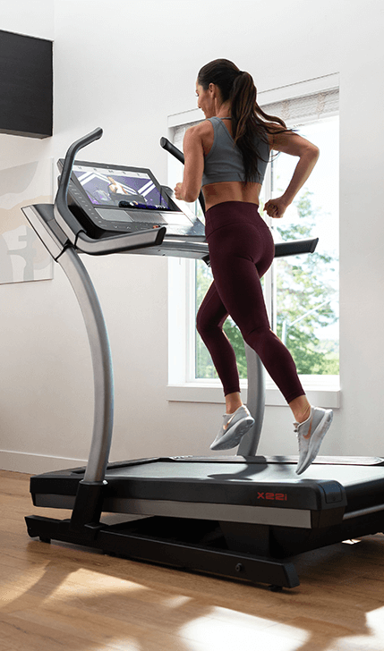 Woman on NordicTrack Commercial X22i Treadmill