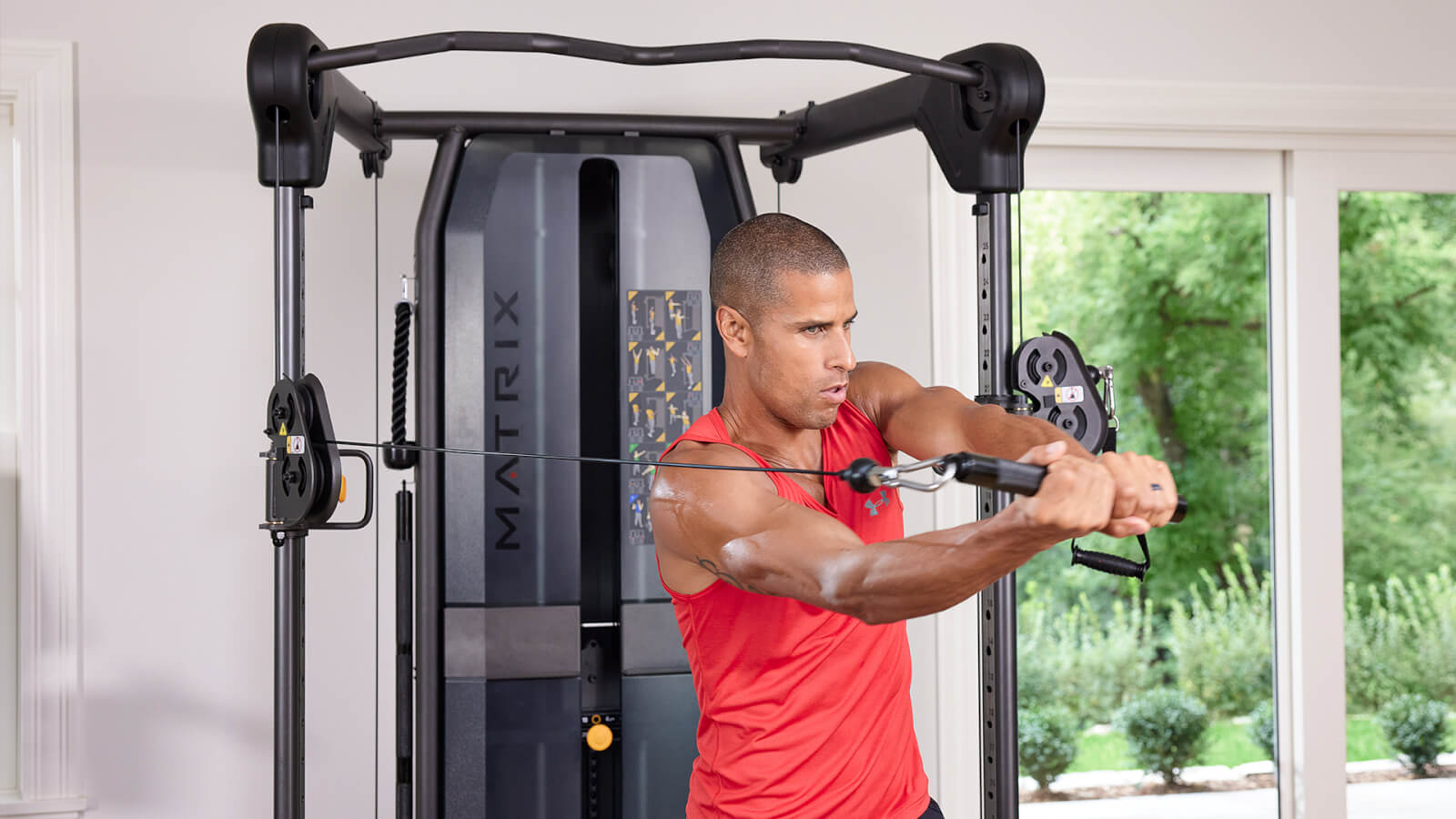 Man working out on a Matrix FTR30 functional trainer