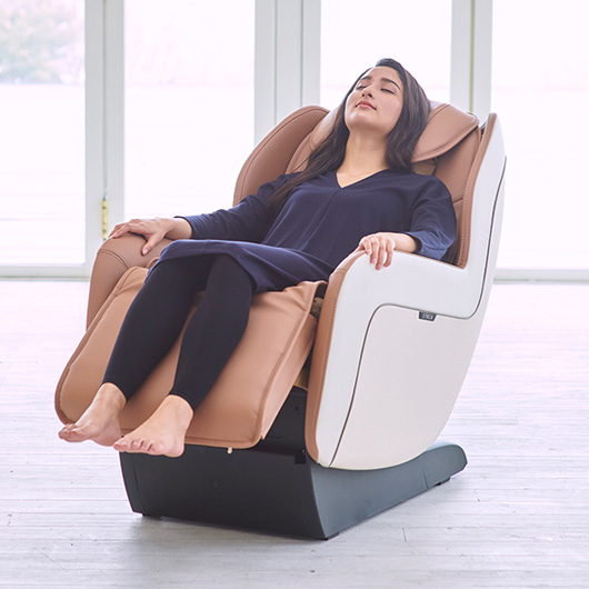 Woman relaxing in Synca Circ+ Massage Chair