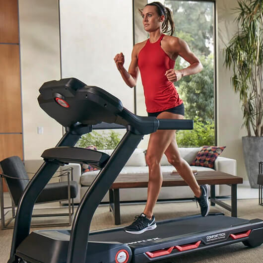 Woman running on Bowflex treadmill