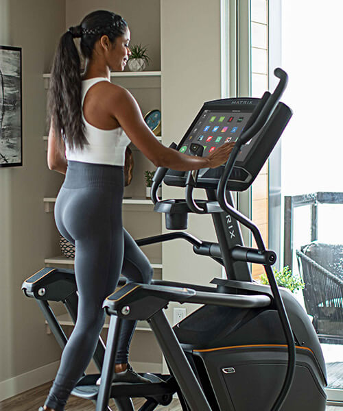 Woman working out on Matrix elliptical