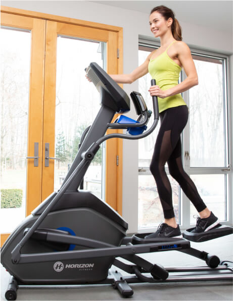 Woman working out on elliptical