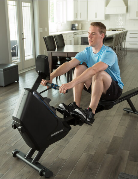 Man working out on a rowing machine