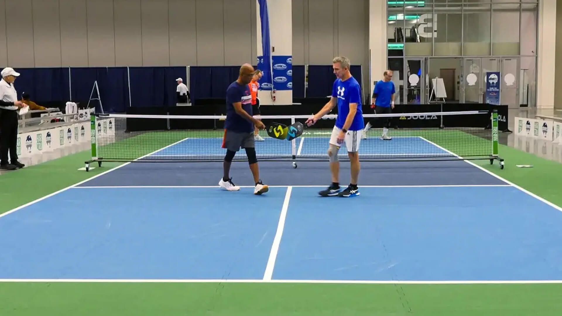 Pickleball match being played on a Ecore MODCourt Pickleball surface