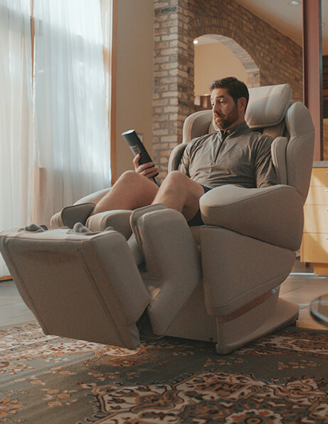 Man relaxing in massage chair