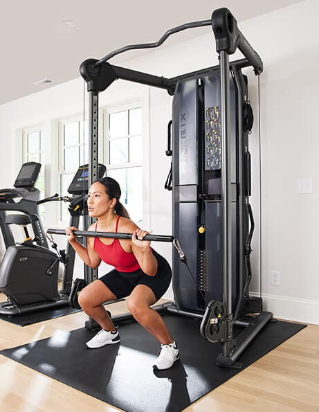 Woman working out on a home gym