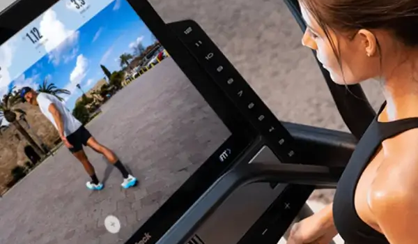 Woman in front of large touchscreen