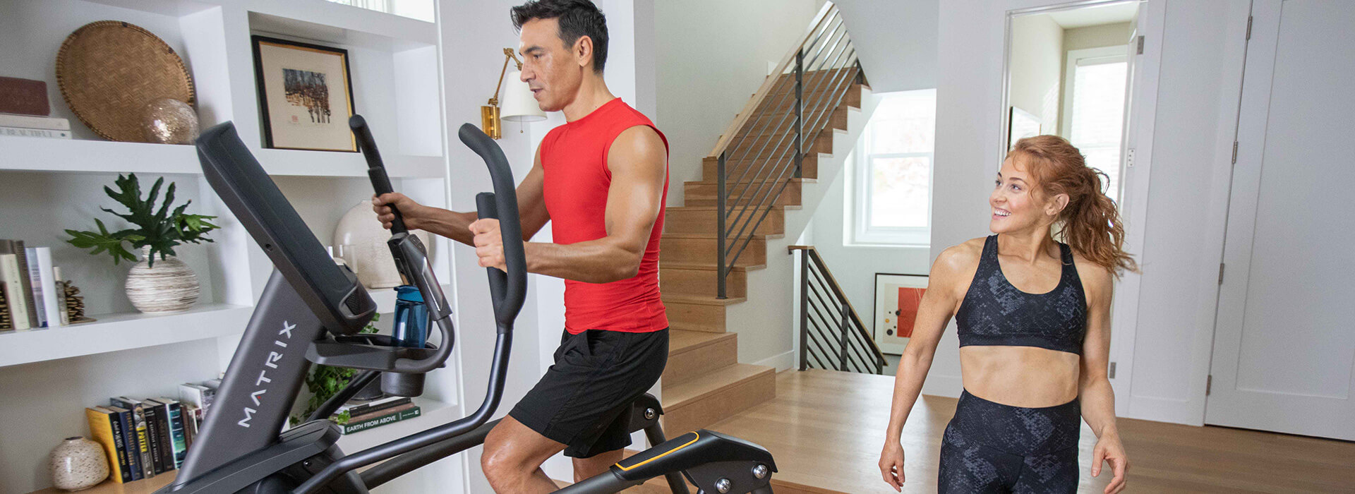 Woman interacting with iFIT app on Matrix console